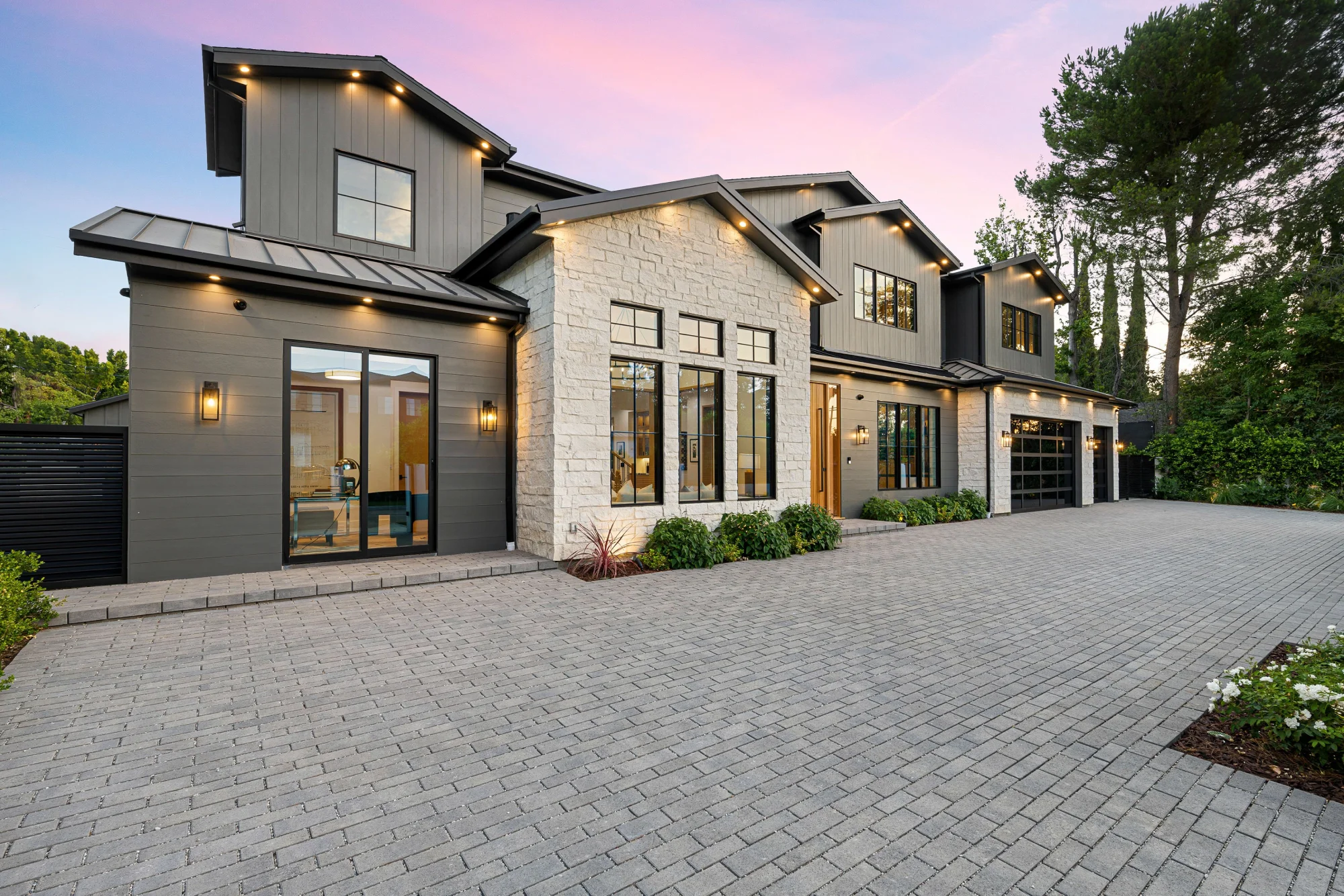 Contemporary home exterior with stone facade.